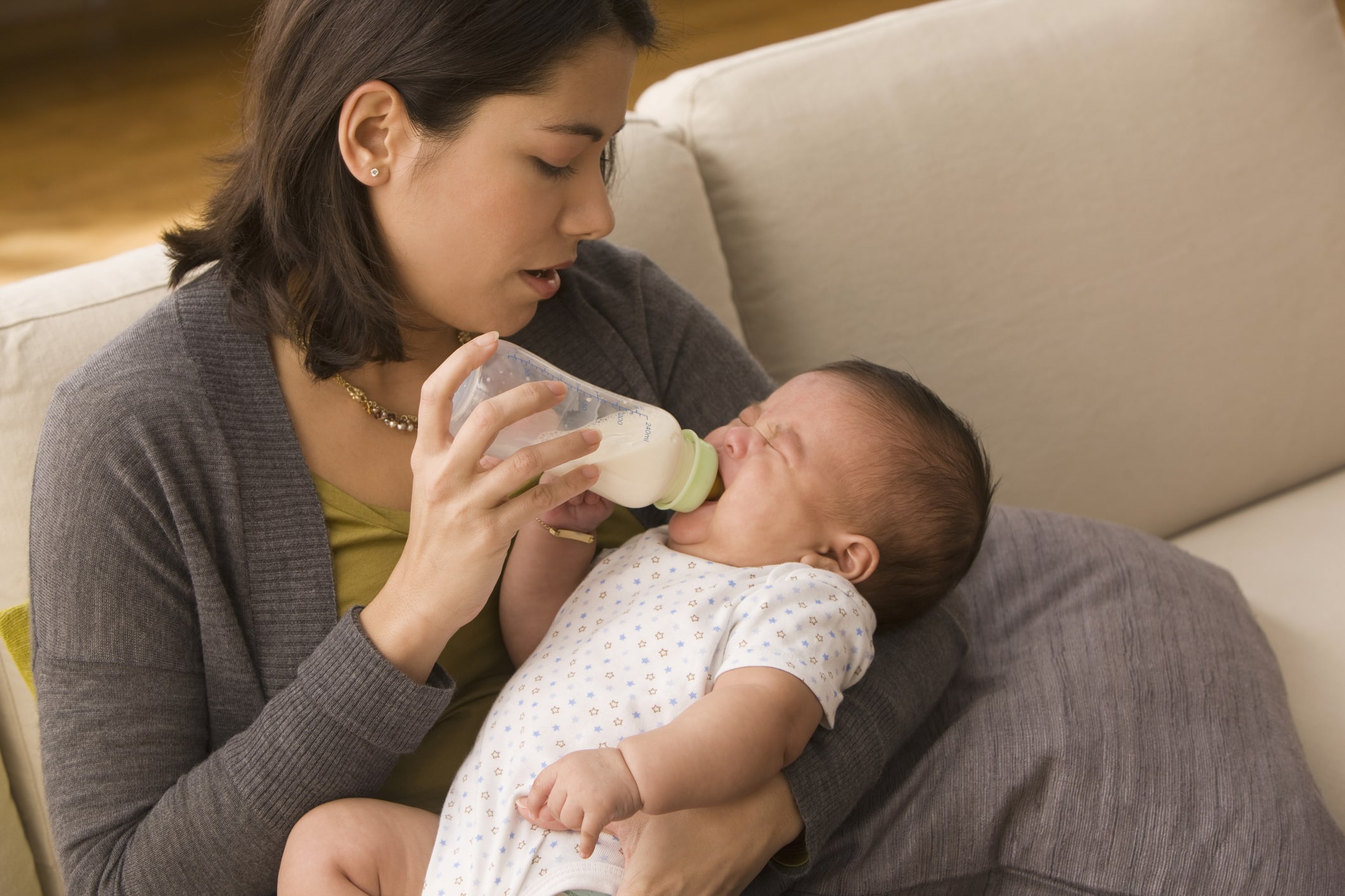 Mother feeding baby bottle